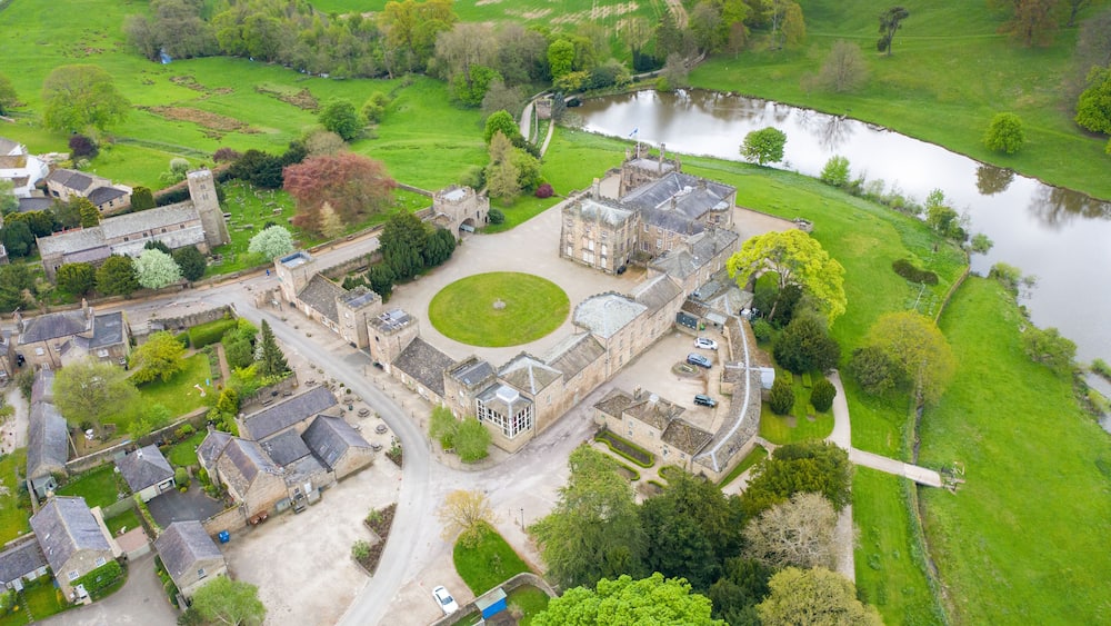 Aerial photo of the small village of Ripley in Harrogate in North Yorkshire in the UK showing the historical Ripley Castle