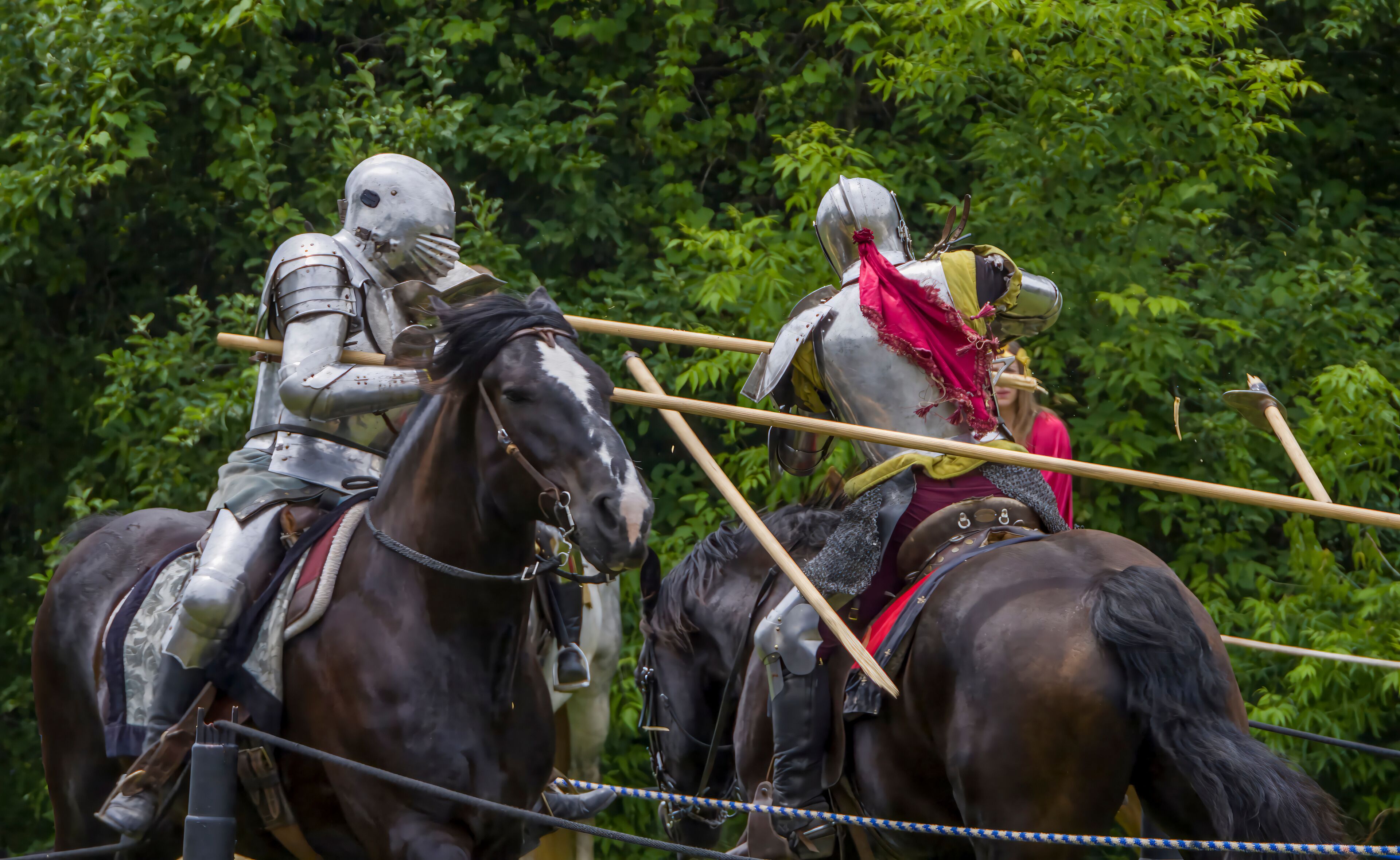 Knights in full armor joust at a bustling medieval faire in Toronto's Black Creek Pioneer Village.