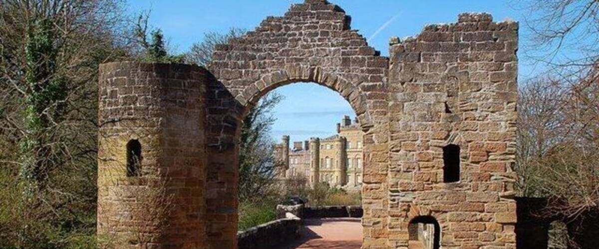Culzean's Ruined Arch The arch was constructed as a ruin to add to the overall effect of the castle site. It lies at the start of a viaduct leading to the castle, which can be seen through the opening.