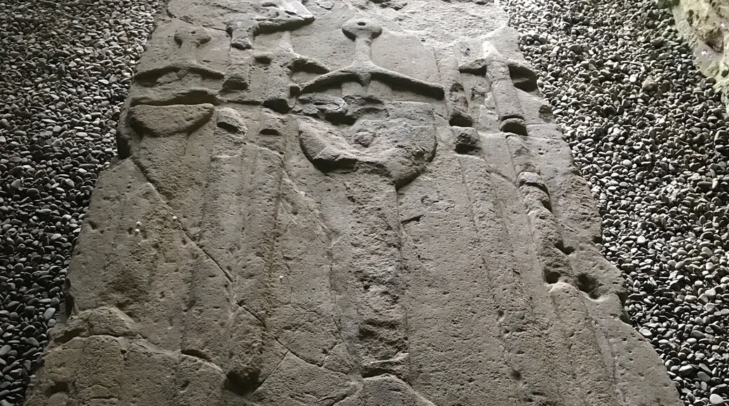 Carved medieval tombstone, Possibly of a warrior judging by the swords carved on it.