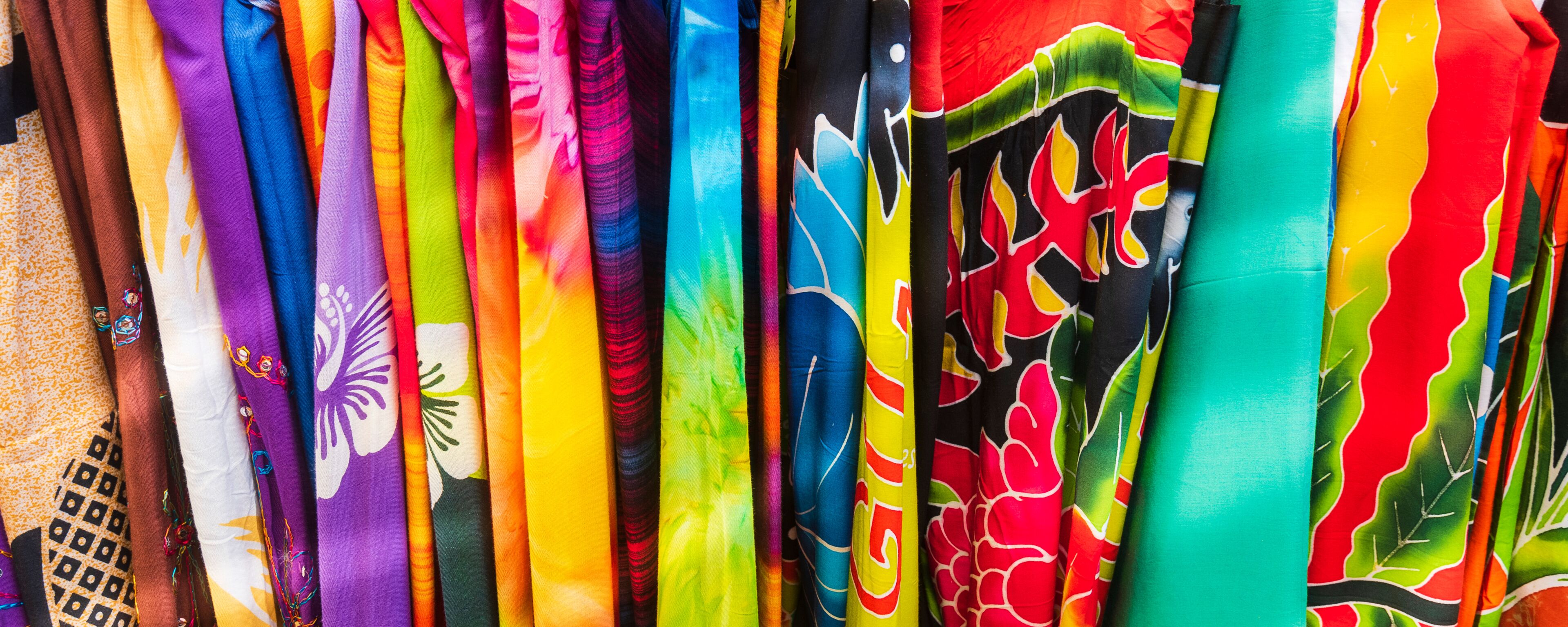 A variety of colorful fabrics with patterns and designs.