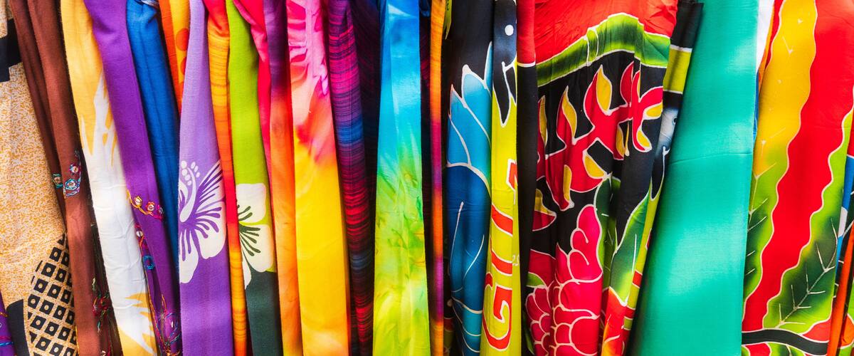 A variety of colorful fabrics with patterns and designs.