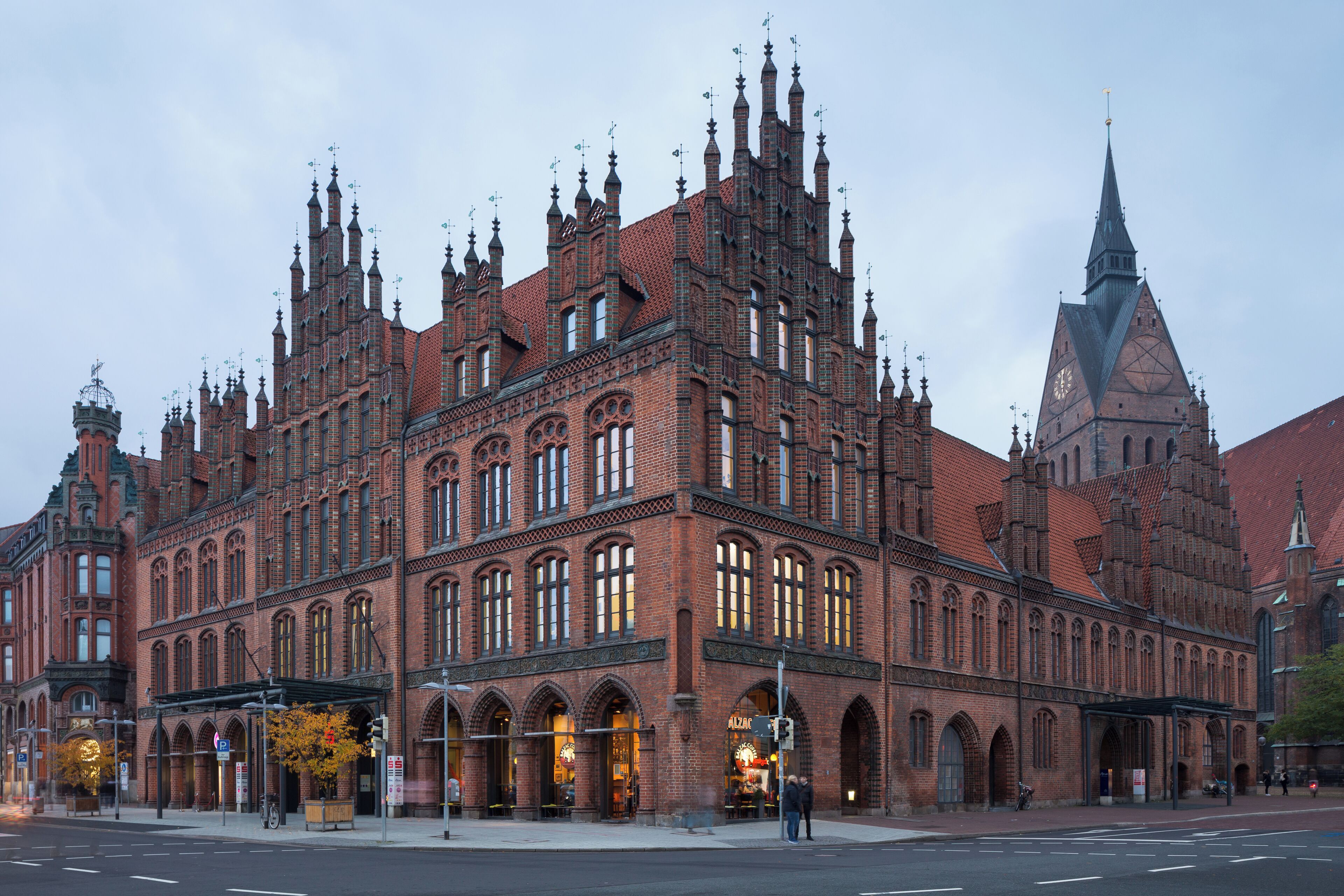 A historic brick building with intricate architecture and a prominent tower.