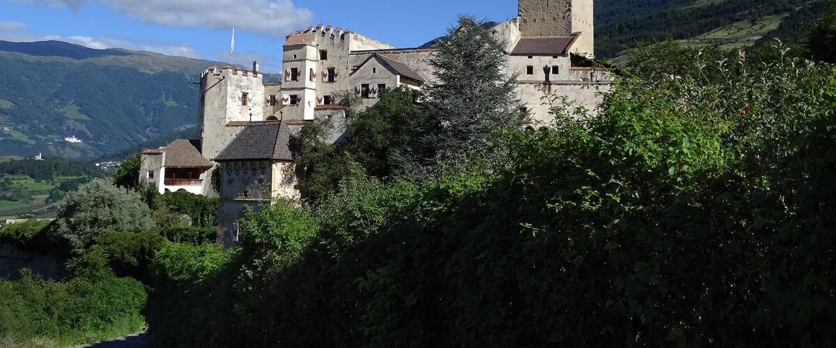 A castle on a hill with a clear sky.