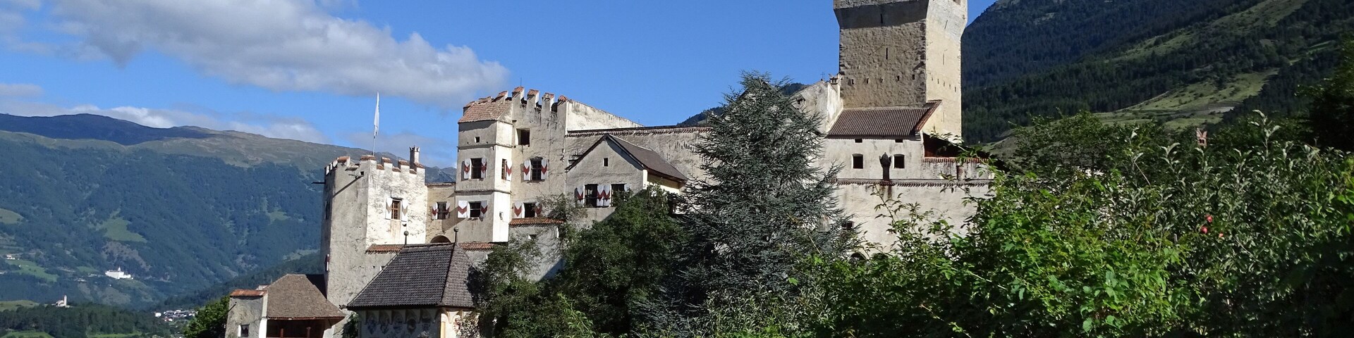 A castle on a hill with a clear sky.