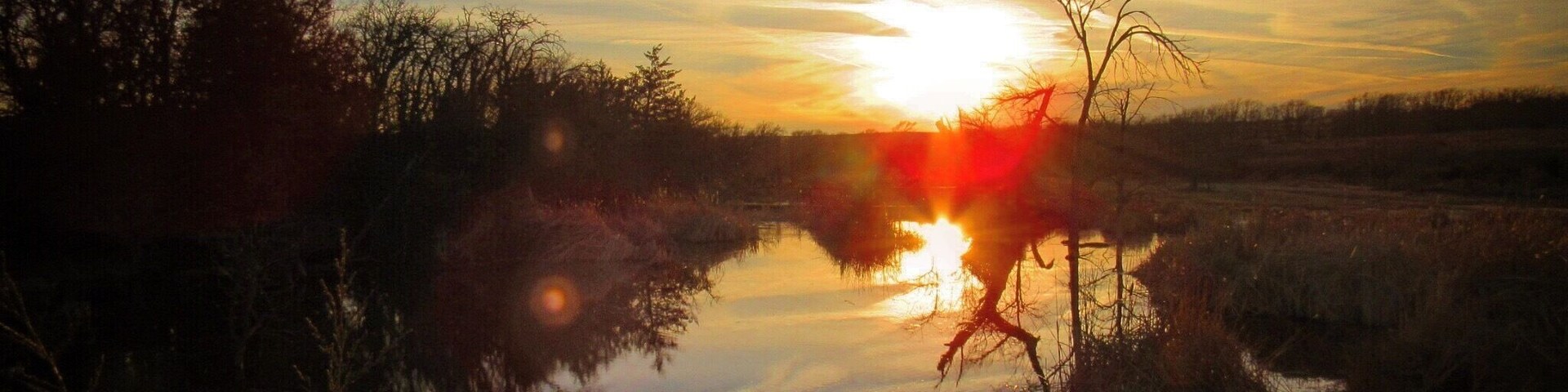 If you are looking for a nice hike, this lake has about a three mile trail all the way around it. A beautiful hike through woods, grassland, wetland, with beaver dams, lots of water fowl, and of course, beautiful sunsets and sunrises. Enjoy!