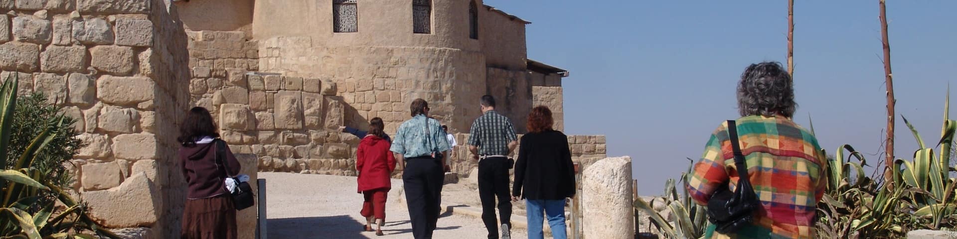 Mount Nebo featuring heritage architecture and religious elements as well as a small group of people