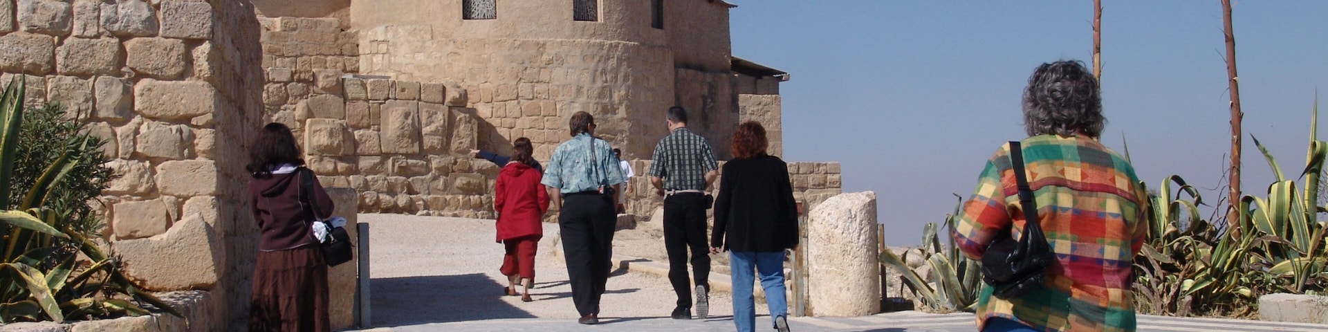 Mount Nebo featuring heritage architecture and religious elements as well as a small group of people