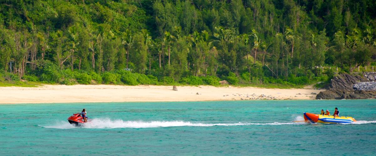 Busena Marine Park featuring tropical scenes, a sandy beach and jet skiing