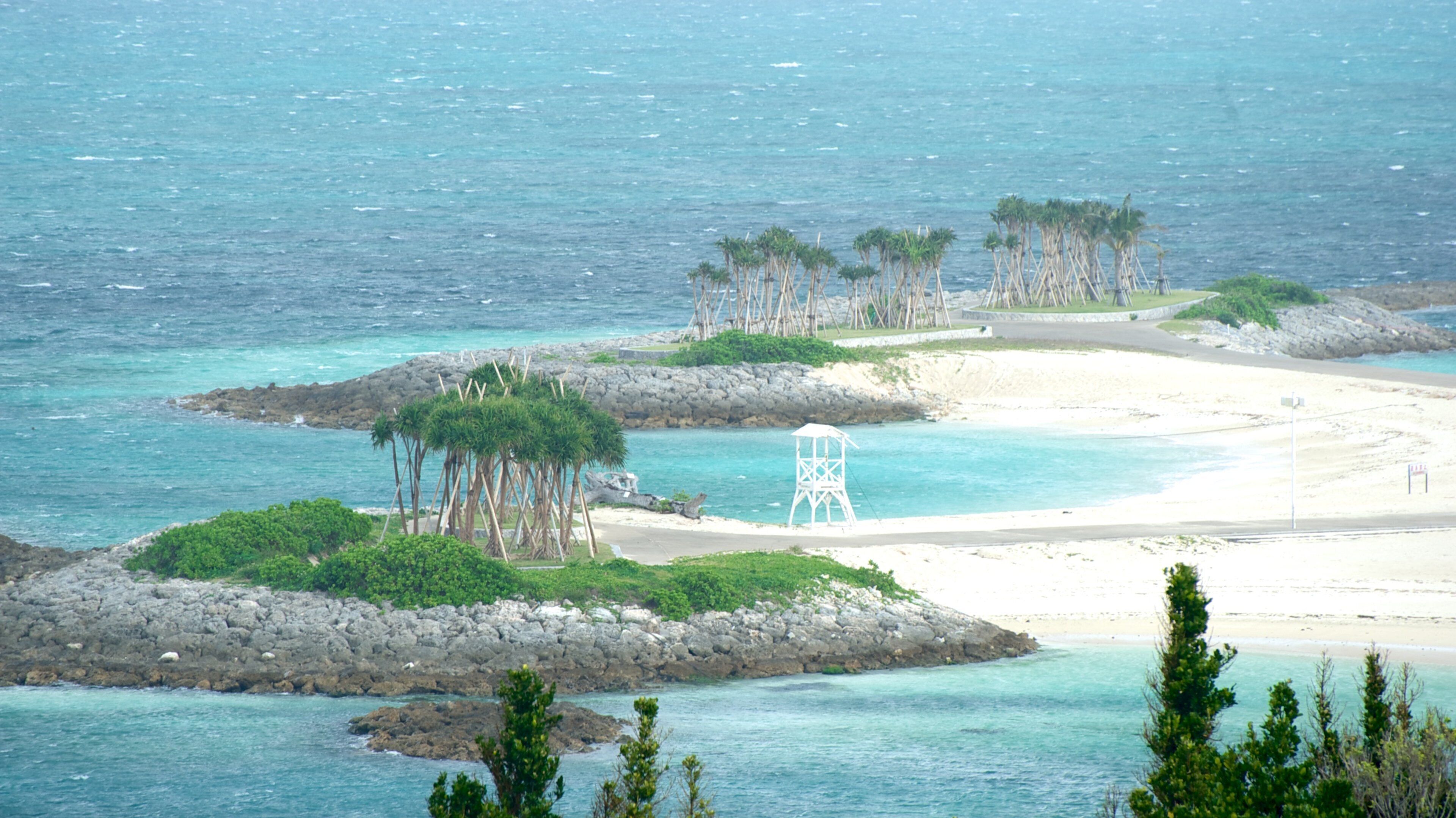 Okinawa Churaumi Aquarium which includes general coastal views and island images