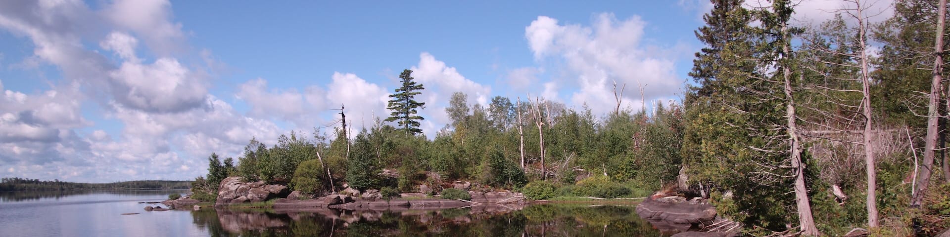 reflection of trees in Isabella lake in the Boundary Waters Canoe area Minnisota