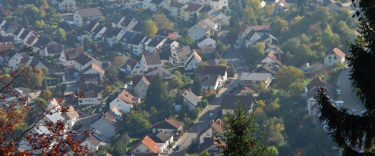 A residential area with houses and trees.