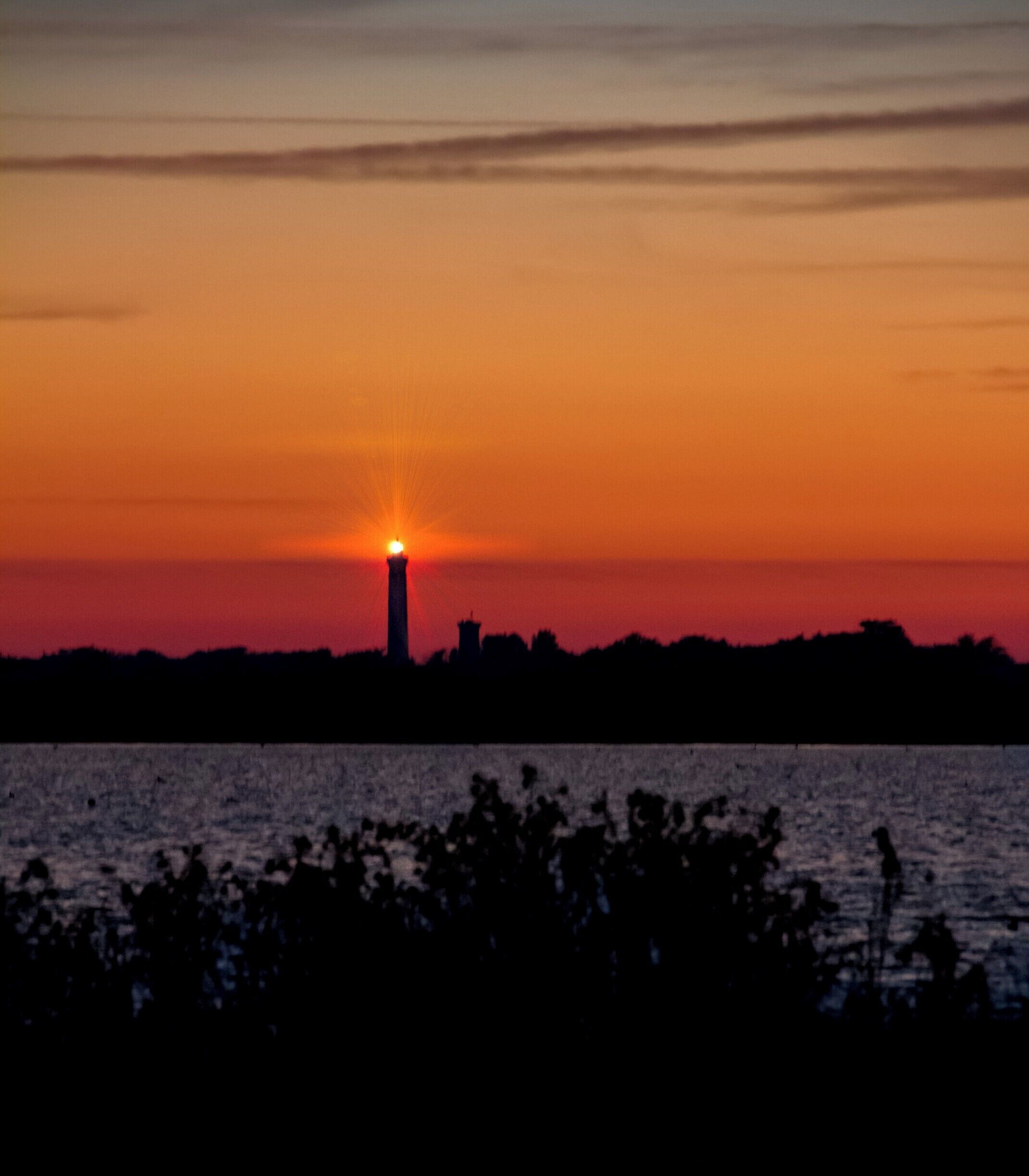 The very last light on the Phare des Baleines (whales lighthouse) from the salt evaporation ponds north of the Ile de Re.