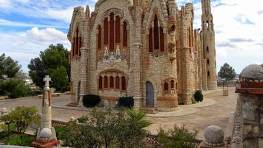 A historic stone cathedral with intricate architecture and a prominent bell tower.