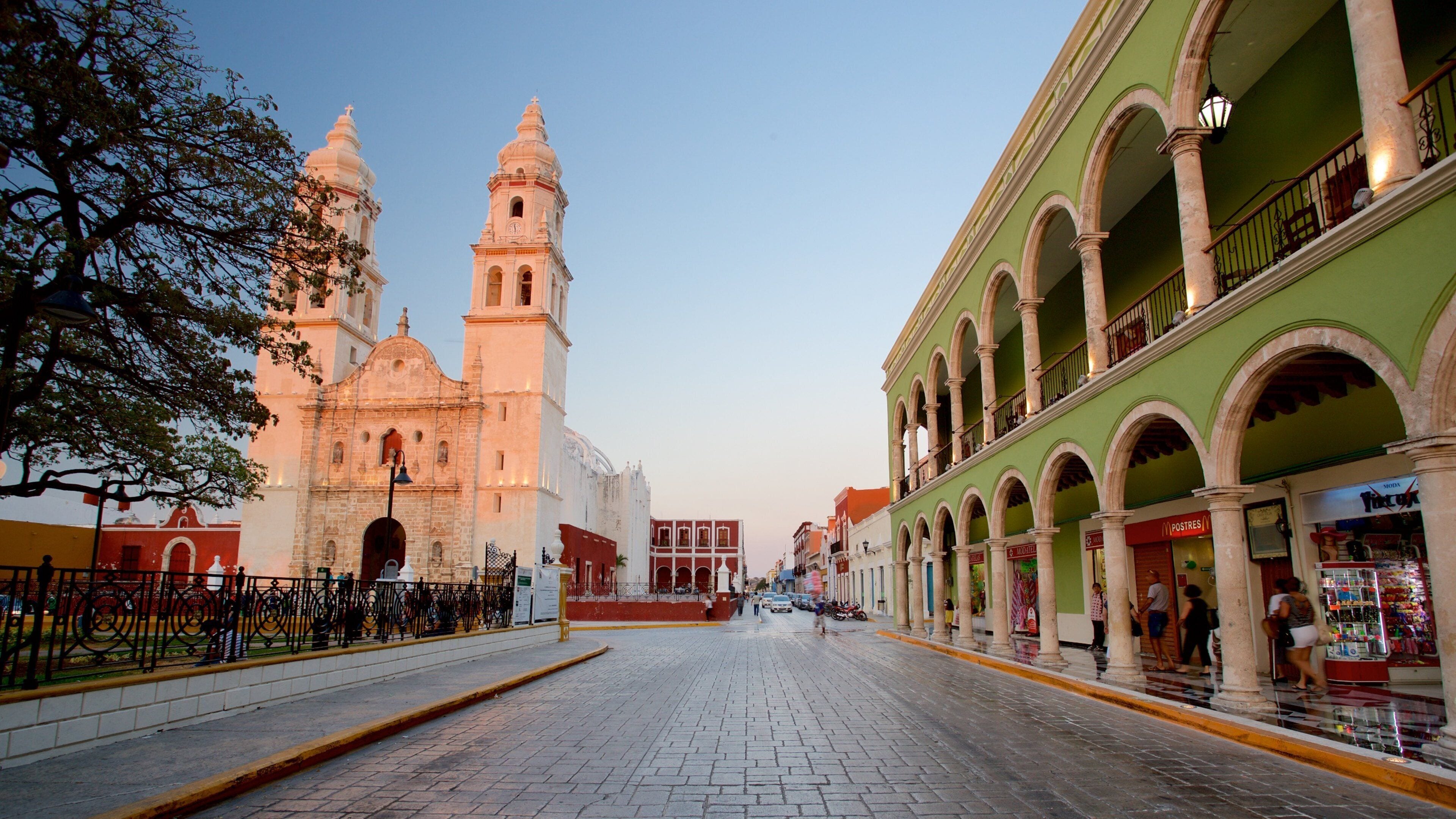Campeche Cathedral which includes a sunset and heritage architecture