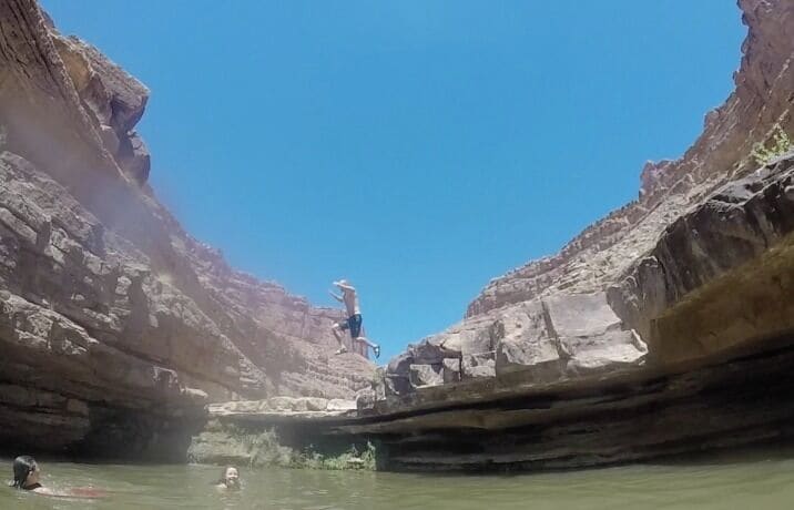 Two miles up a small canyon on our 4th day on the San Juan there is a stream that when you follow it up you find cool pools of fresh water waiting to be enjoyed.

It was 100 degrees this day, we were in need of a refreshing dip. My little brother chose to cannon ball into this hidden oasis.

#Hiking photo travel sweepstakes