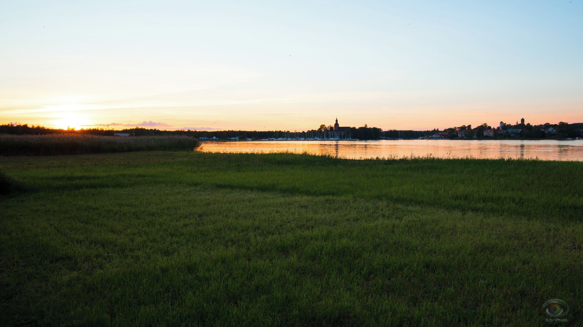 Beautiful camping next to the lake. The city next to it is very beautiful on sunset