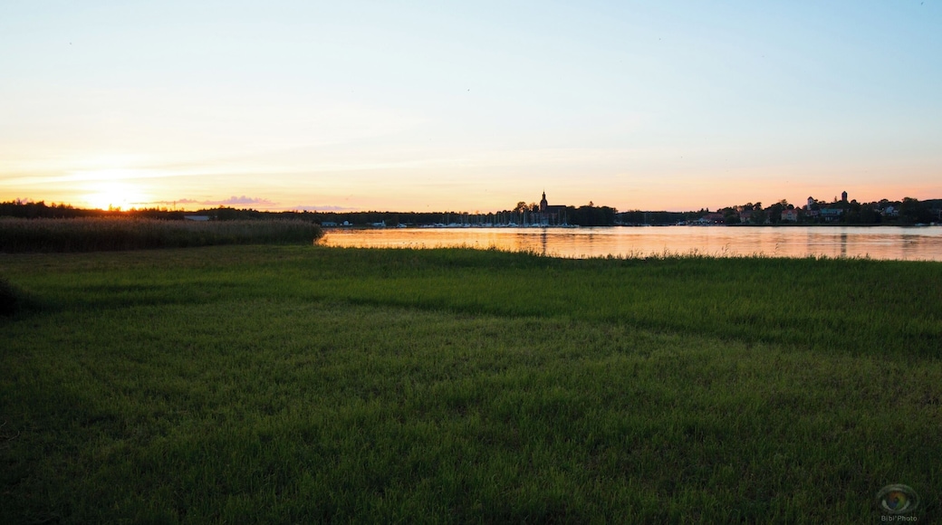 Beautiful camping next to the lake. The city next to it is very beautiful on sunset