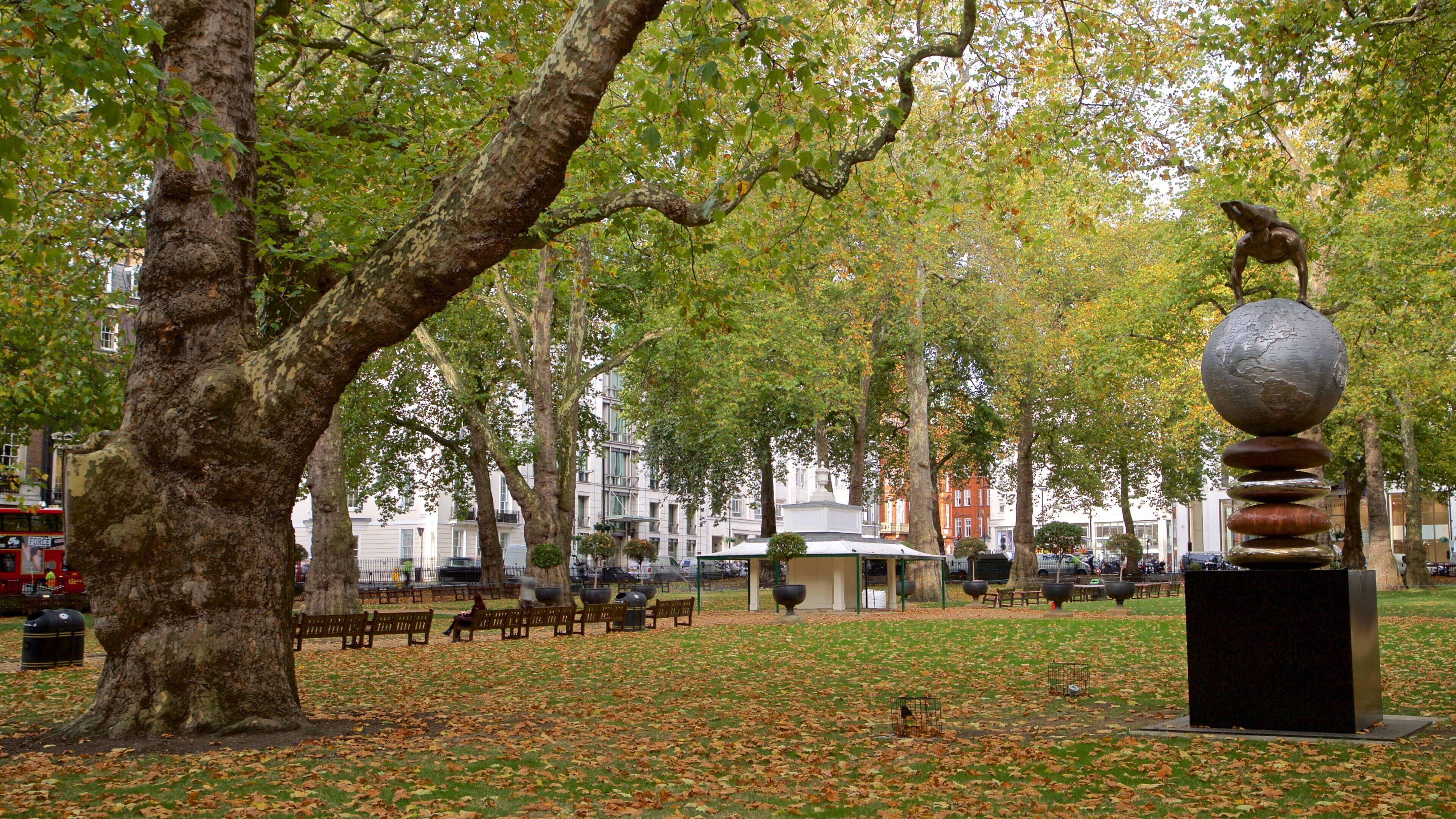 Berkeley Square showing fall colors, outdoor art and a park