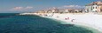 Panoramic snurise view of white pebble beach of Mediterranean sea. Marina di Pisa. Italy.