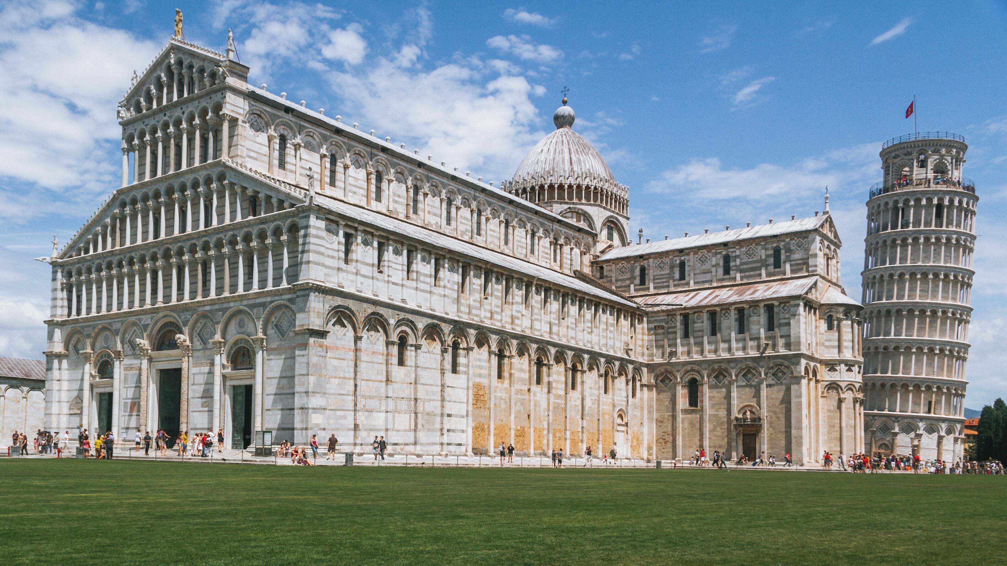 Exploring the architectural wonders of Piazza del Duomo in Pisa, Tuscany, Italy under a clear blue sky