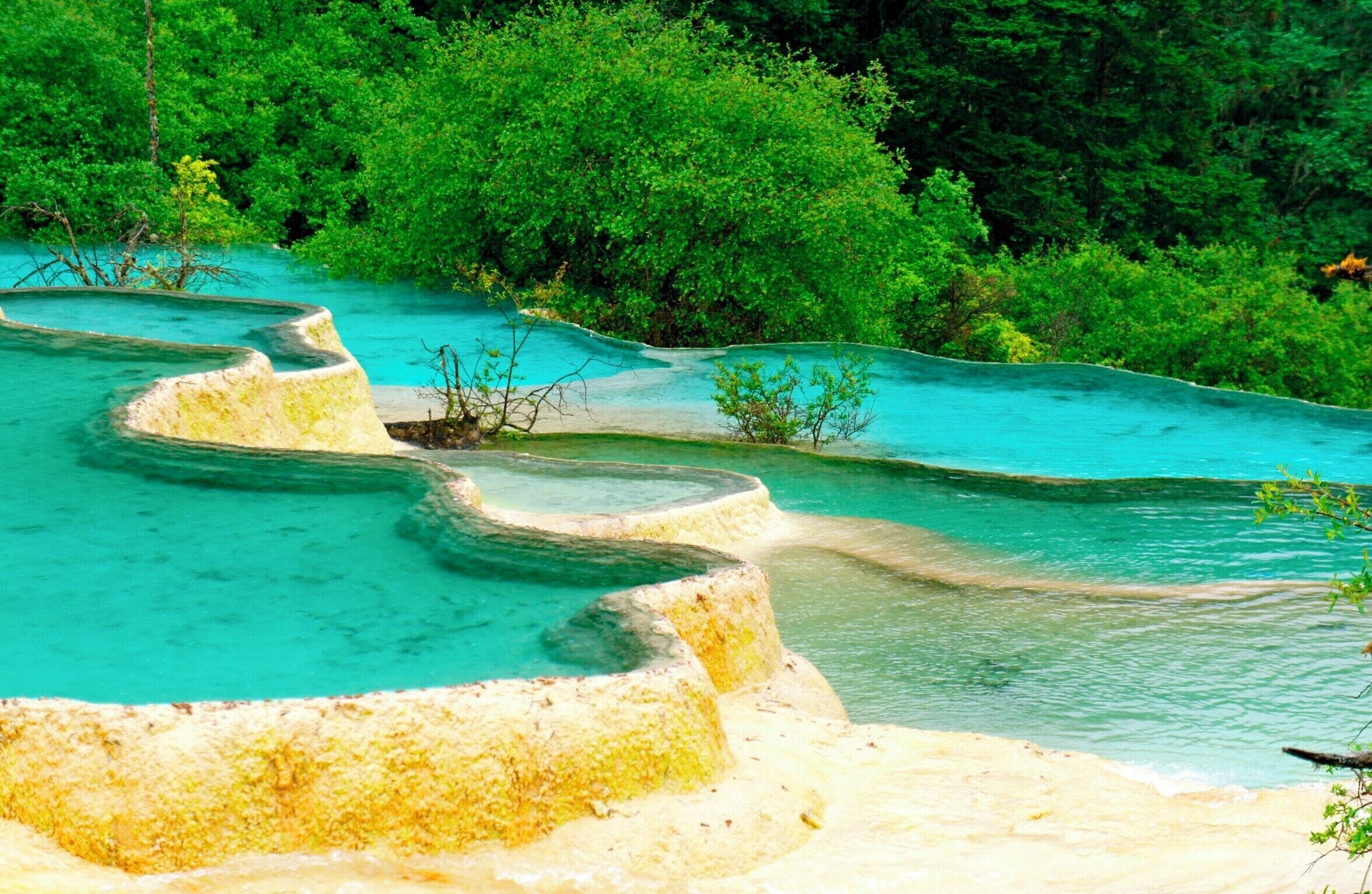 Huanglong, Sichuan China

This amazing place is located on above 3,500m altitude high. It gave me a headache as I got there, but the scenery itself was absolutely stunning. Totally worth it!