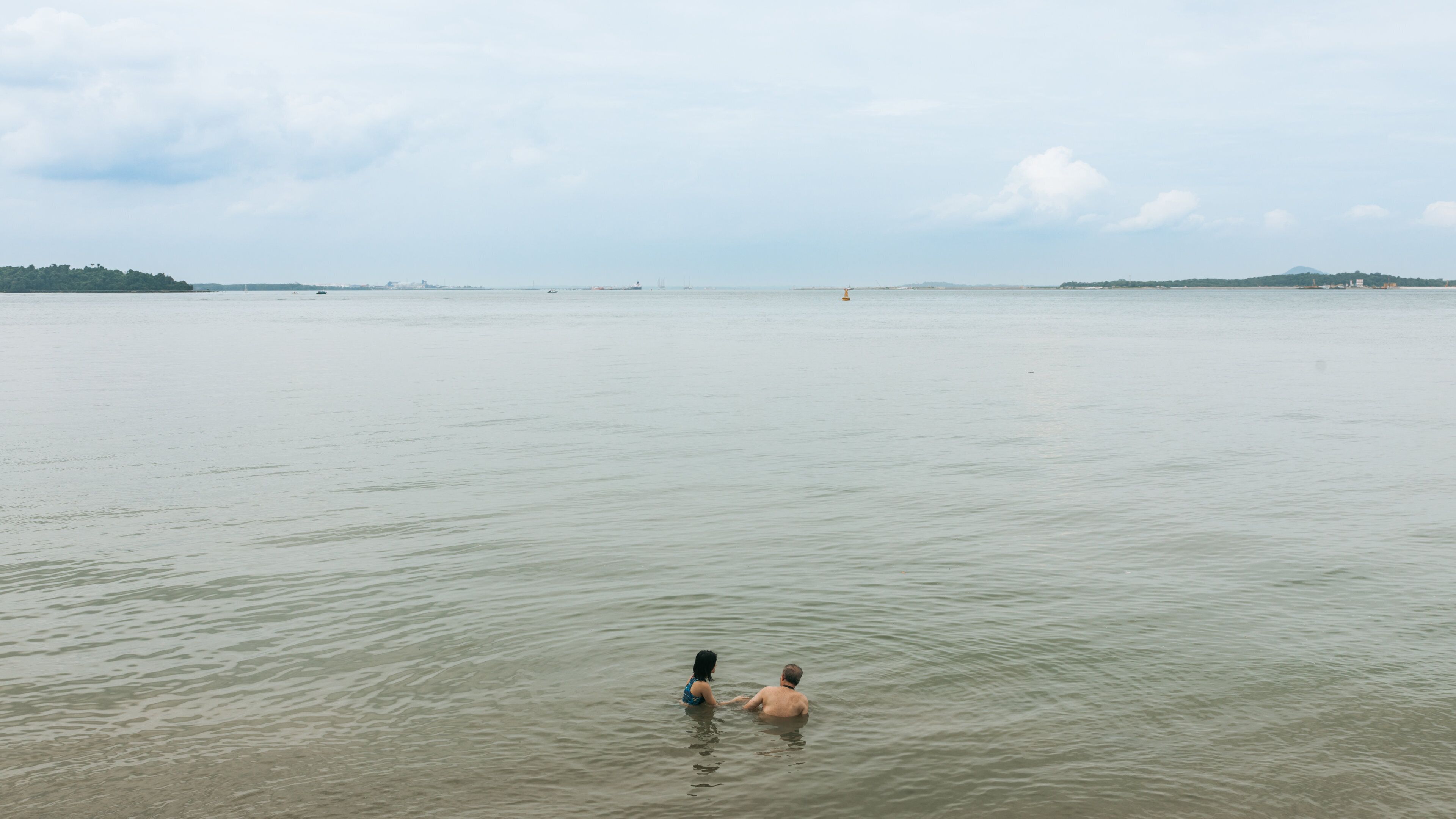 Changi Beach Park which includes swimming and general coastal views as well as a couple
