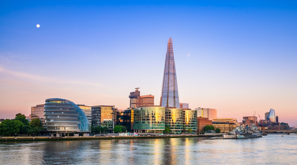 Queens walk on the south bank of River Thames at sunset in London. England
