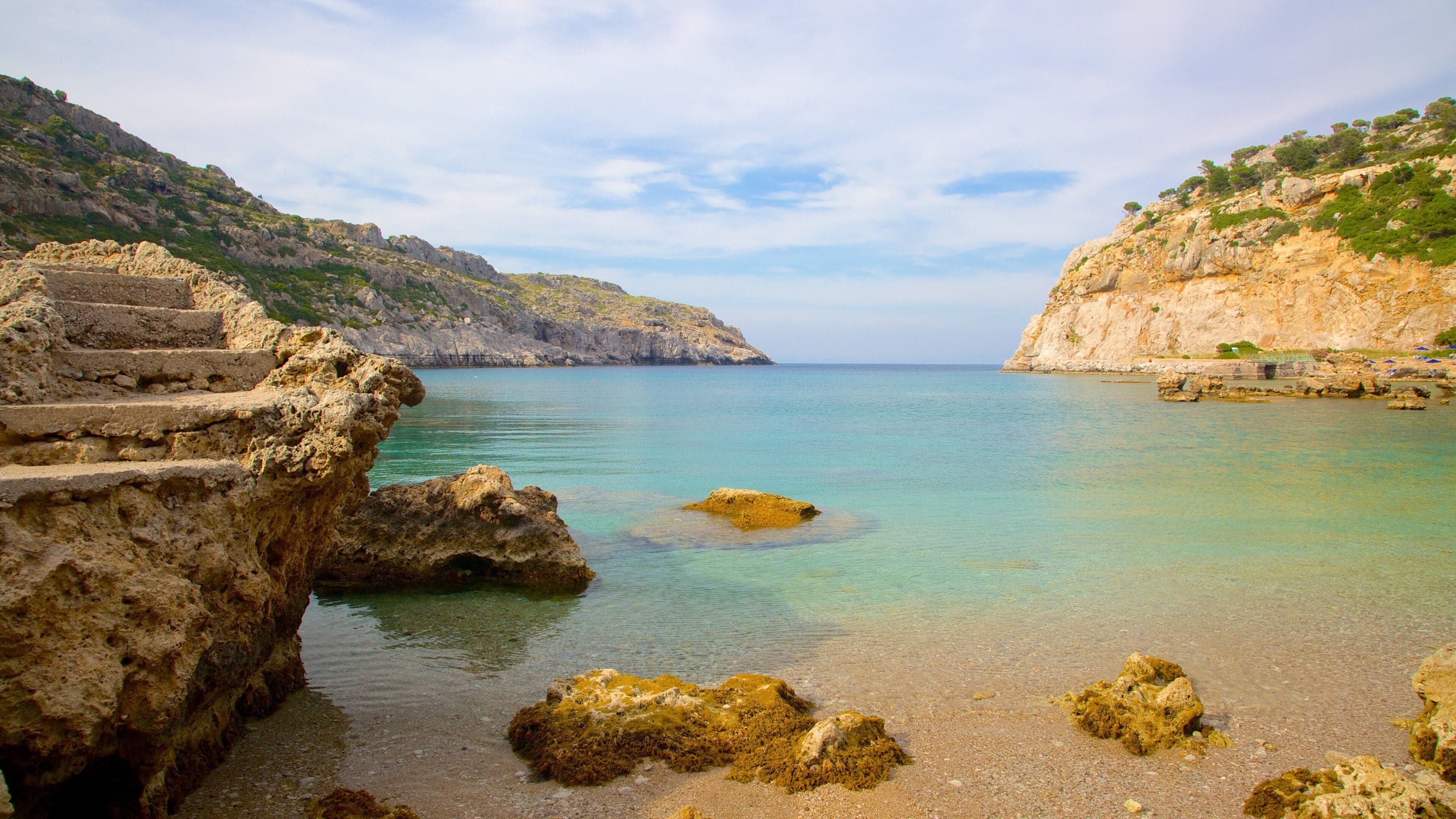 Anthony Quinn Bay showing rocky coastline