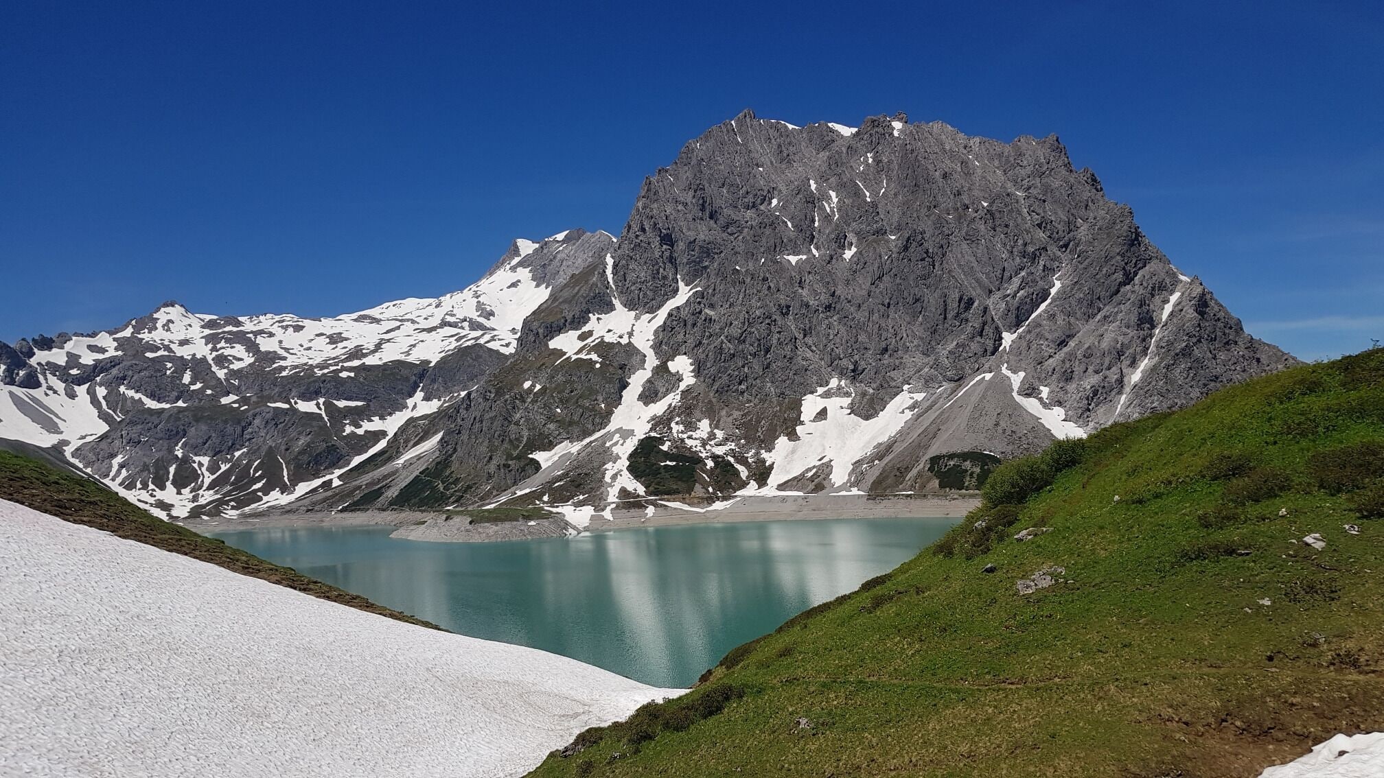 Mountains, snow and grass at the Lünersee, Austria!