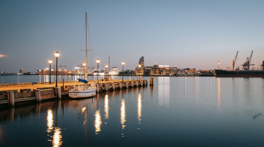 Fells Point which includes a marina and a sunset