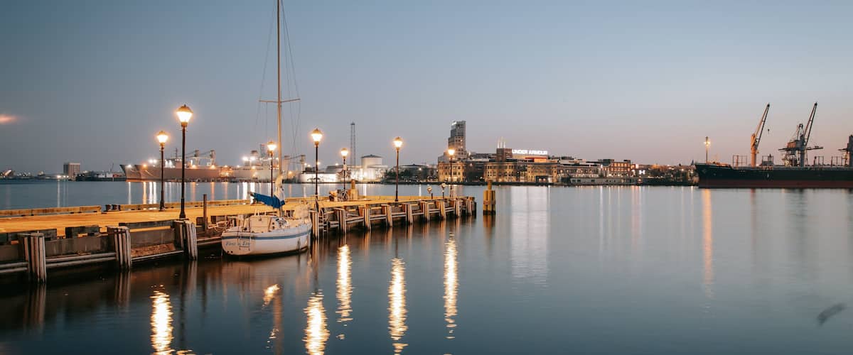 Fells Point which includes a marina and a sunset