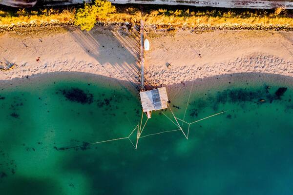 Pialassa della Baiona, Marina Romea, Ravenna, Emilia Romagna, Italy, Europe. Fishing hut in the salt lagoon.