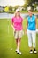 Family, happy and woman for golf sport outdoor for fitness challenge, physical activity or support of recreation match. People, game practice and bonding and training for country club event on field