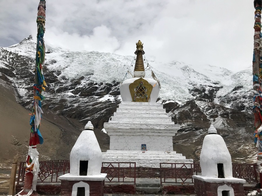 Elevation: 5560 meters (18,241 feet) About two hours away from Yamdrok Lake. It isn't a big glacier, but the white glacier is spectacular from the highway, and it is close enough (about 300 yards) to walk to from the highway.