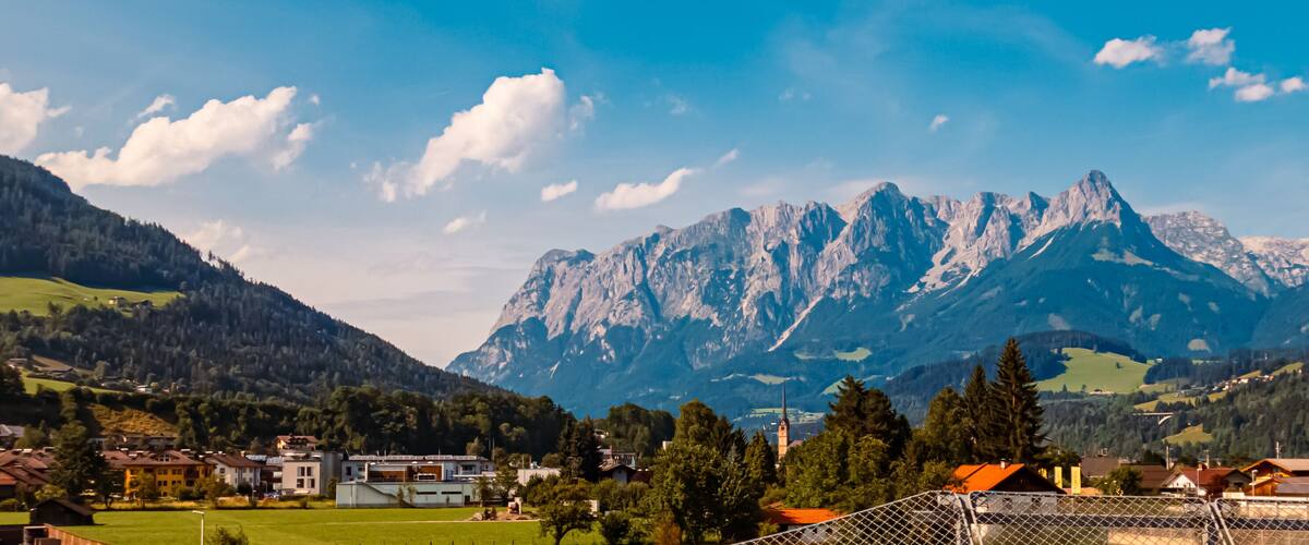 A mountain range with a village in the foreground.