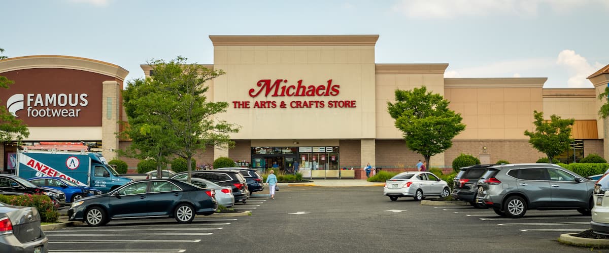 A shopping center with a Michaels The Arts & Crafts Store and a Famous Footwear store.