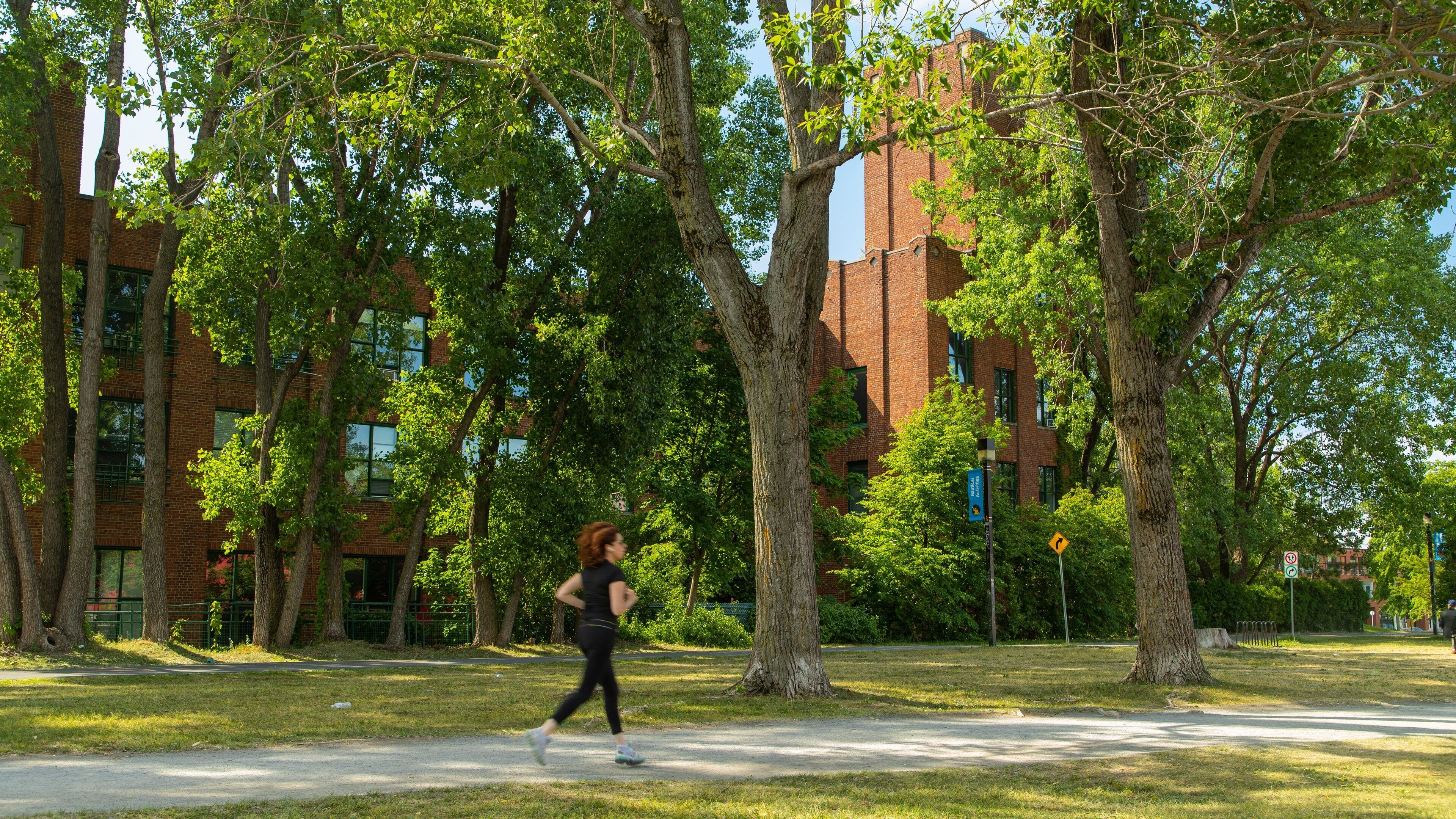Lachine Canal National Historic Site featuring a park as well as an individual femail