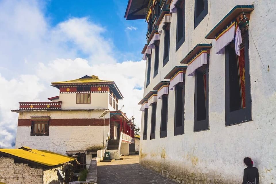 A traditional building with colorful decorations and a clear blue sky.