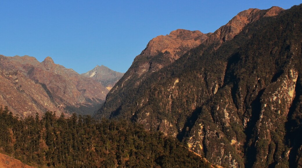 scenic snowcapped himalaya mountain range and arid alpine landscape near tawang hill station close to india-china border in arunachal pradesh, india