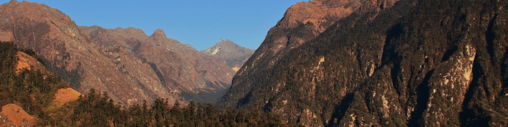 scenic snowcapped himalaya mountain range and arid alpine landscape near tawang hill station close to india-china border in arunachal pradesh, india