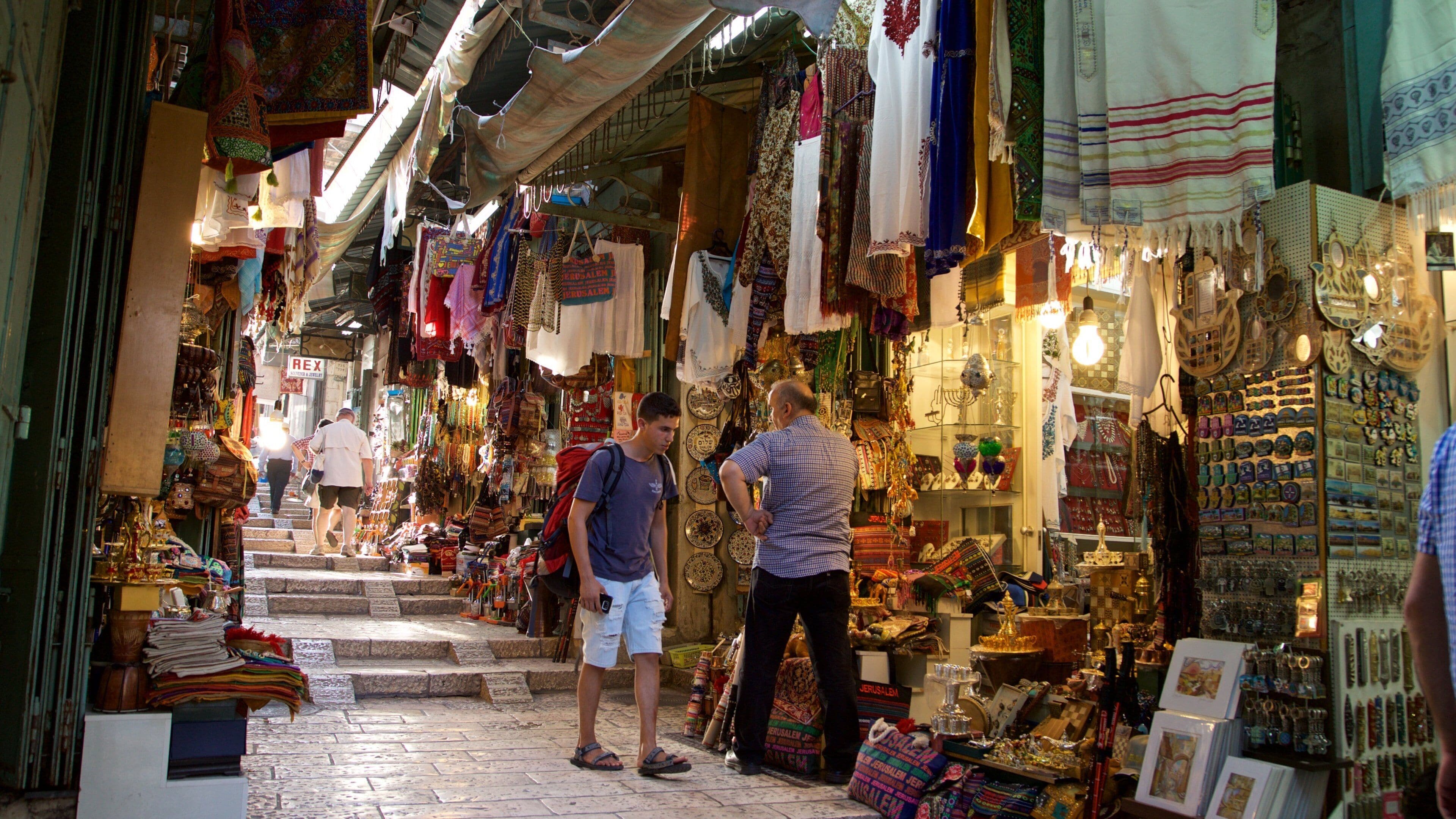Mahane Yehuda Market which includes street scenes and markets as well as a small group of people