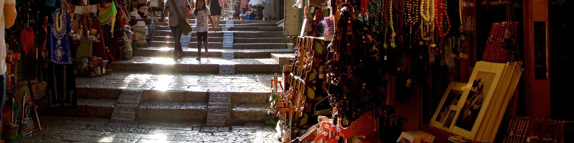 Mahane Yehuda Market which includes markets and interior views as well as a family