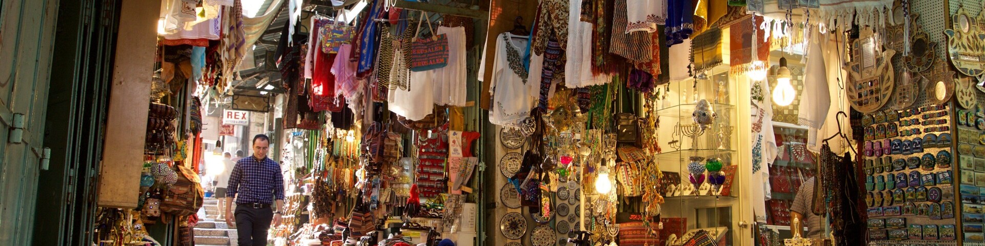 Mahane Yehuda Market featuring markets and street scenes as well as an individual male