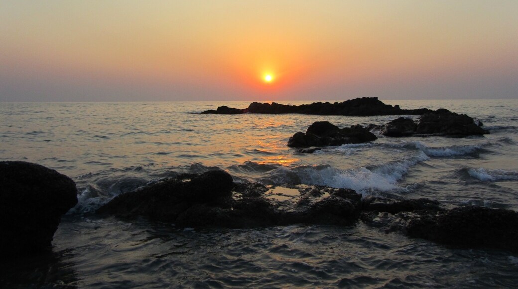 Om beach is shaped like the Hindu symbol 'om'. One of the most serene and tranquil beaches in India. There are a bunch of yoga resorts around the beach, a great place to chill out