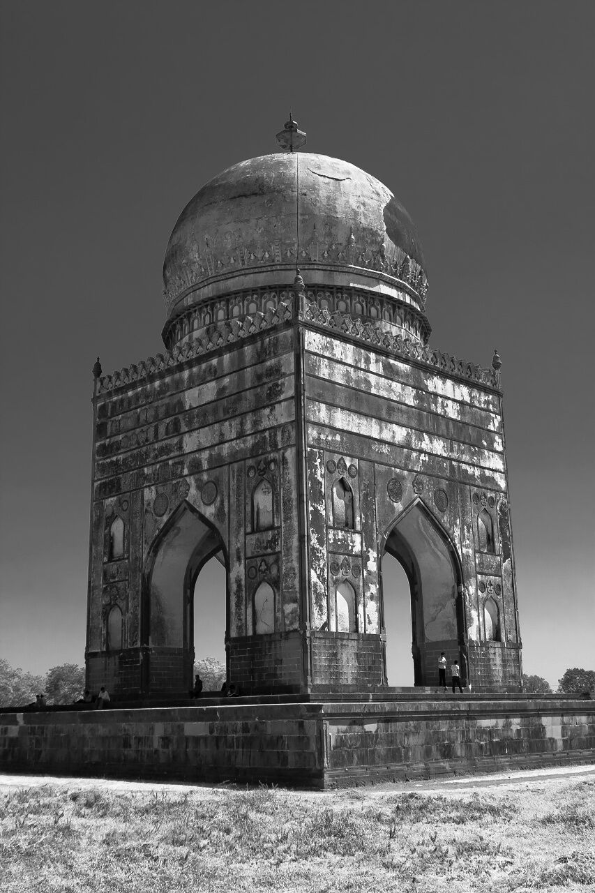 A historic building with a large dome and arched windows.