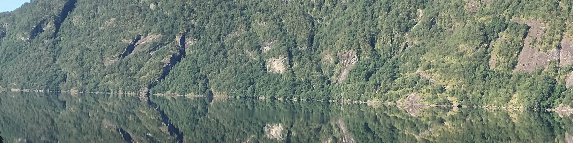 Driving to Voss from Bergen, the water was so still this morning, the reflection looks like a continuation of the mountain.