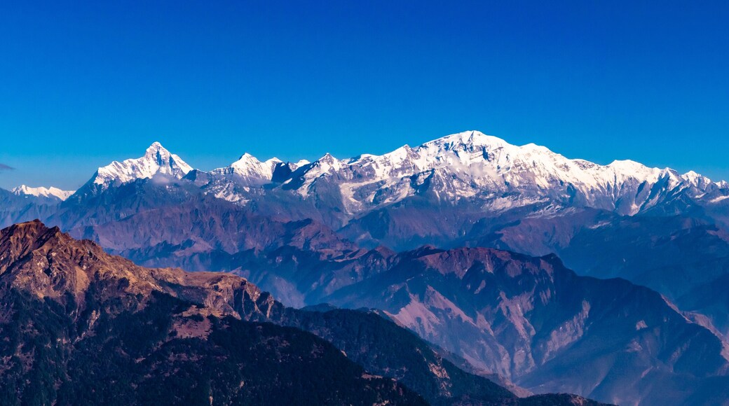 Panoramic view Himalayan mountains view from Chandrashila summit, Chopta. Chandrashila is a peak in the Himalayan ranges in Uttarakhand state of India. It lies at an altitude of 12,083 ft from the sea