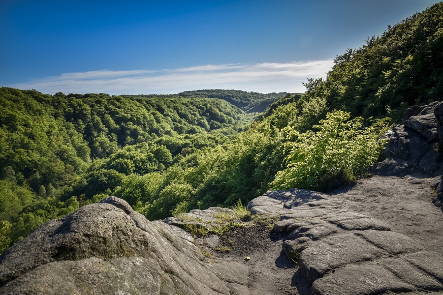 Great view over the green and lush forest valley of Soderasens National Park from cliff Sweden