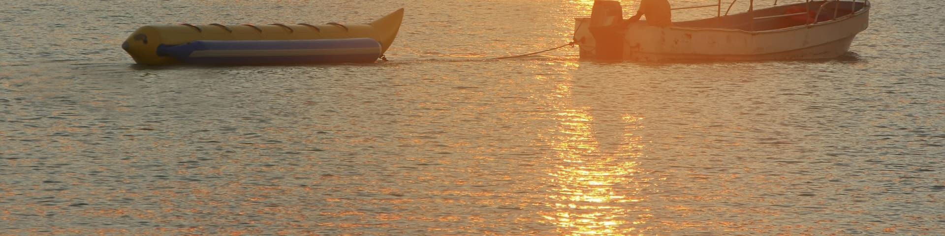 Banana boat in Boca Chica bay at sunset, Dominican Republic
